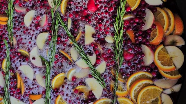 fruit compote in a vat at a street fair close-up. Fruity rosemary punch. High quality 4k footage