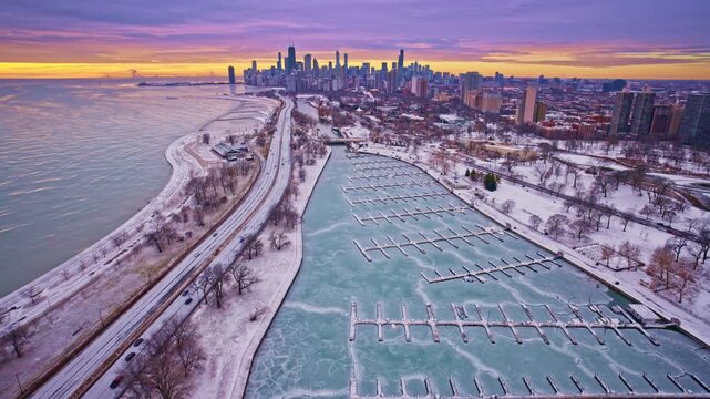 High-altitude sunrise drone view of the Chicago Loop with skyline and waterfront.