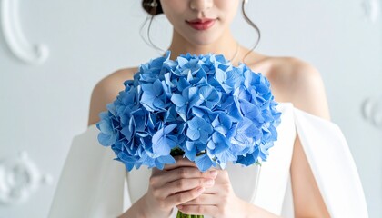Bride Holding Beautiful Blue Hydrangea Bouquet Delicate Wedding Concept Elegant Woman in White Dress Purity and Grace.