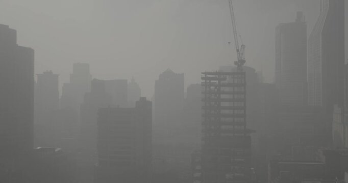 Shanghai, China. Time-lapse Urban Skyline with construction site works. crane working development. City Business Center. Smog at morning, smog in big city