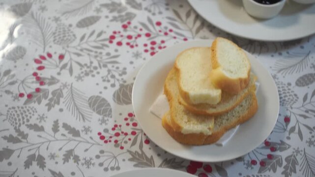 Breakfast of workers at the factory in close-up. There are eggs, cheese, butter, honey, prunes, tea and bread on the table.