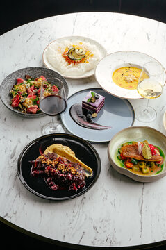 fried pike perch fillet with sauce and vegetable stew