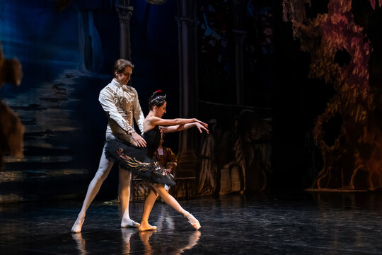 Male ballet dancer and female ballerina performing classical dance