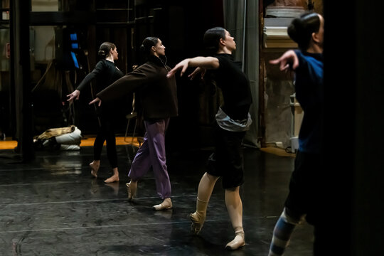 ballet dancers rehearsing on stage. Classical dance lesson