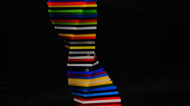 Colorful spiral shape with gradient colors made of Cast Acrylic Sheet - Plexiglas creating vibrant abstract DNA pattern and mesmerizing abstract on dark background