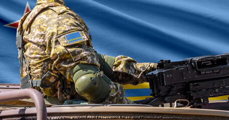 Aruba flag with soldier at machine gun turret in front of it. Closeup side view. © lucky pics