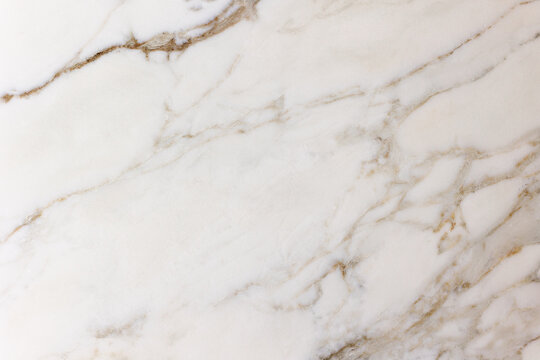 White marble surface with natural veining
