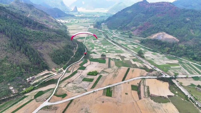 Bird&lsquo;s-Eye View of Paraglider Over Guangxi's Karst Terrain