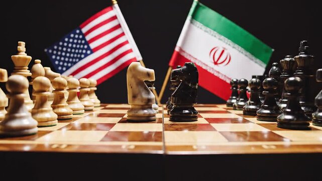 Chessboard with U.S. and Iran flags behind opposing knights facing off, symbolizing strategic rivalry, geopolitical tension, and calculated diplomatic confrontation.