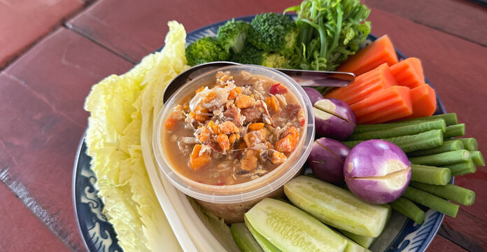 Traditional Thai crab egg chili paste with fresh garden vegetables.