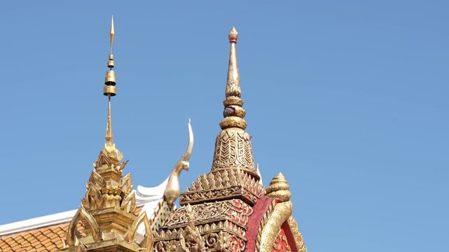 CHIANG MAI, THAILAND - FEBRUARY 3, 2026: Intricate golden architectural details and Buddha images at the famous Wat Phra That Doi Suthep temple complex. Close-up details of a sacred golden Buddha stat