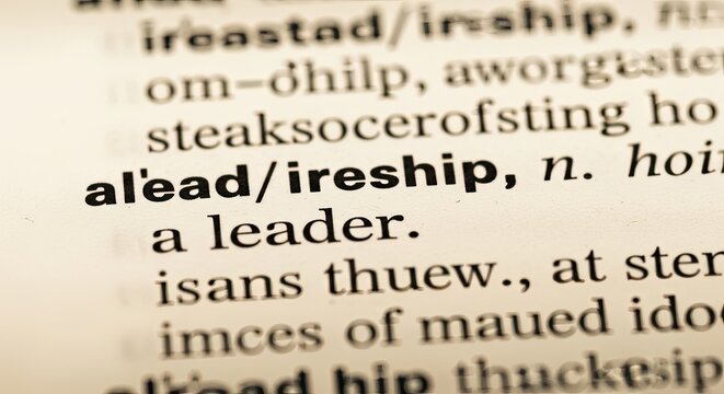 Dictionary entry with bold printed leadership definition on aged sepia paper, business leadership Concept