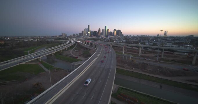 Establishing drone shot of Houston, Texas urban landscape at night