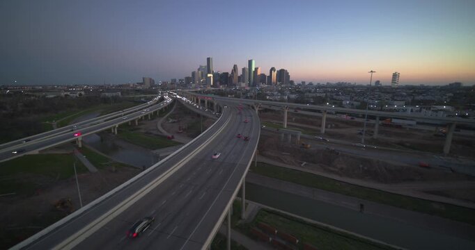 Wide angle drone shot of Houston, Texas urban landscape at night 