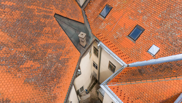 Aerial view of terracotta rooftops and a small courtyard, a geometric puzzle of urban architecture, Sremska Mitrovica, Vojvodina, Serbia.