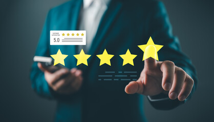 Fototapeta premium Businessman touching five star rating icon for customer satisfaction survey. Concept of excellent service quality, feedback, business reputation, and digital marketing evaluation.