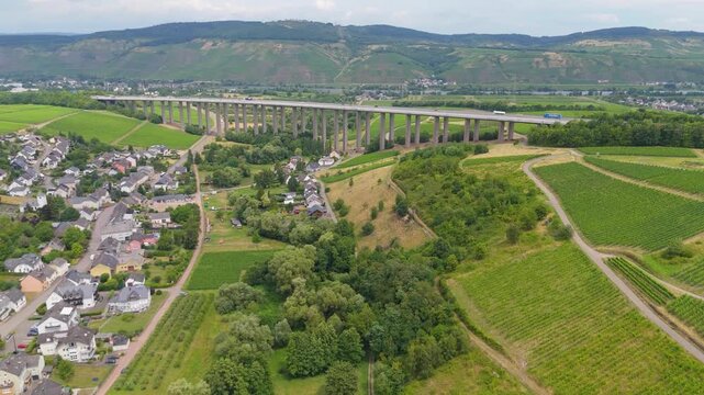 Moselle valley and Viaduct Longuich, vineyards of Mosel, bridge of highway crossing river near Trier, german autobahn, aerial view