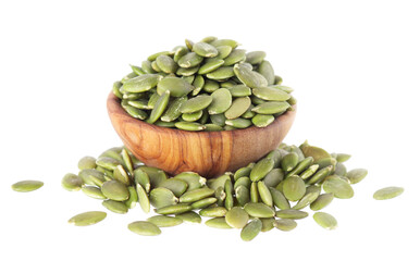 Pumpkin seeds isolated on white background. Green peeled pumpkin seeds in wooden bowl. Clipping path.