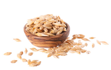 Malted barley grains isolated on white background. Barley seeds in wooden bowl. Clipping path.