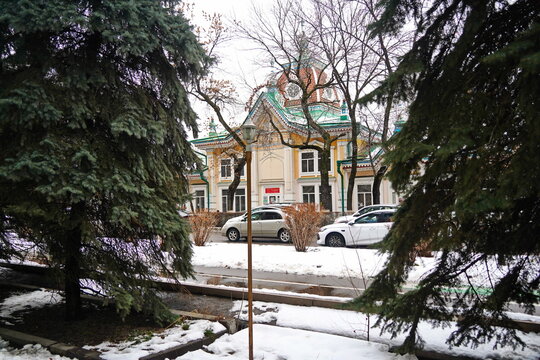 Almaty, Kazakhstan - 02.27.2026 : The facade of the ancient House of Fabrics "Kyzyl Tan", 1896.