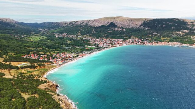 Aerial panoramic view of Ba&scaron;ka town on Krk island, Croatia, with turquoise Adriatic Sea. Concept of summer travel, seaside vacation and European coastal tourism