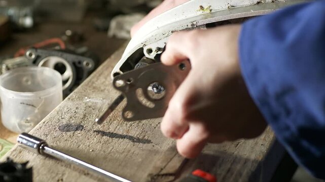 Removing gasket seal from outboard motor lower unit