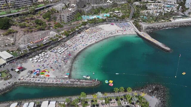 Aerial view of Playa Anfi del Mar and Isla Corazon de Anfi, Gran Canaria, Canary Islands, Spain
