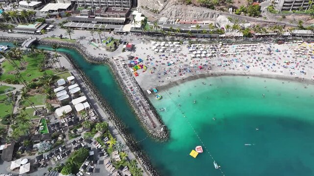 Aerial view of Playa Anfi del Mar and Isla Corazon de Anfi, Gran Canaria, Canary Islands, Spain
