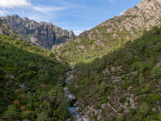 Fototapeta premium Restonica valley river flowing through mountains in Corte, Corsica