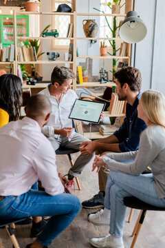 Businessman leading a presentation in loft office