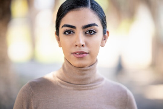 Portait of a beautiful young woman outdoors