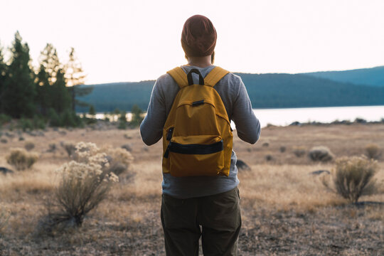 USA, North California, rear view of young man on a hiking trip near Lassen Volcanic National Park
