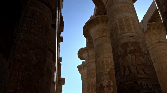 Located within the Karnak Temple Complex in Luxor, Egypt, this upward view captures the towering columns of the Great Hypostyle Hall.