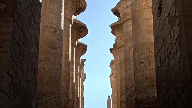 Located within the Karnak Temple Complex in Luxor, Egypt, this perspective looks up at the towering columns of the Great Hypostyle Hall.