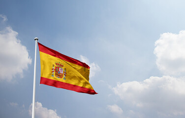Spain national flag waving in sky.