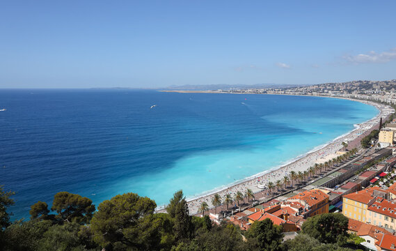 Panoramic view of Baie des Anges in Nice, turquoise sea water and pebbly beach