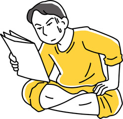 書類を集中して見る男性