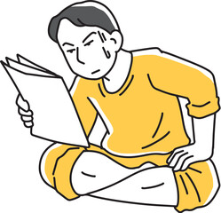 書類を集中して見る男性