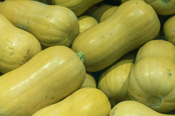 full frame photo of yellow zucchini for sale at the market
