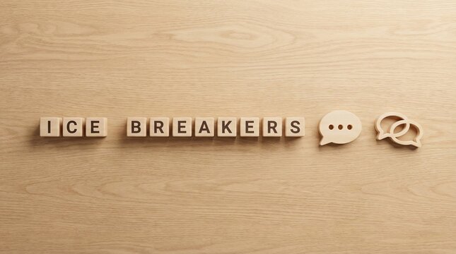 Wooden cubes spelling 'Ice Breakers' on desk, with conversation and speech bubble icons
