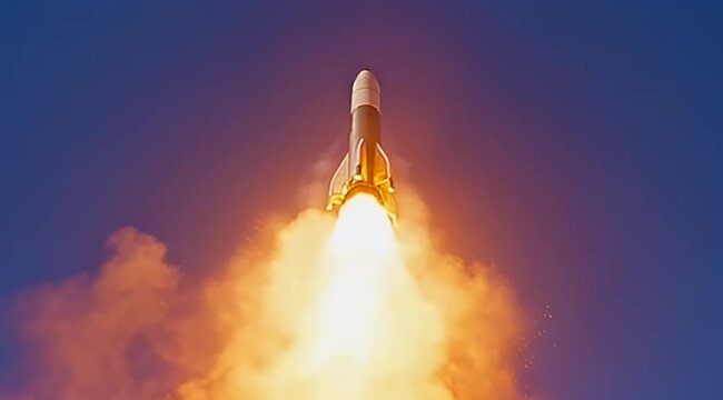 Dramatic rocket launch against a deep blue sky with vibrant exhaust plume