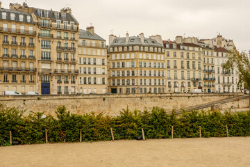Paris river Seine bank with colorful Haussmann architecture buildings, old European city charm and urban travel view
