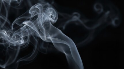 A mesmerizing display of smoke swirling in the dark air