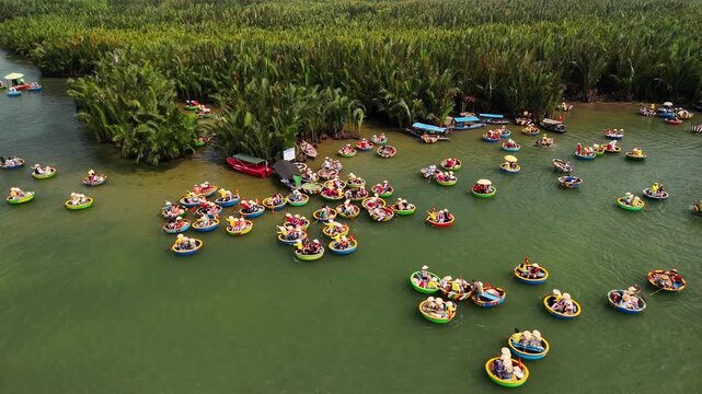 Aerial view of tourists on vietnam basket boats in the coconut forest of cam thanh near hoi an, vietnam