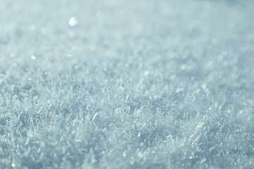 Obraz premium Sparkling hoarfrost and ice crystals on fresh snow in bright winter sunlight.