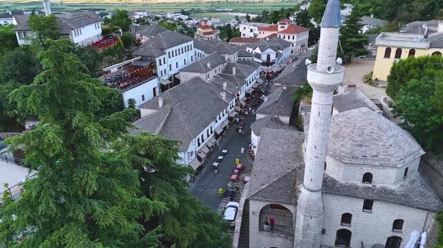 Top Down View of Gjirokast&euml;r&rsquo;s Cobblestone Street.  A vertical aerial view capturing the patterned cobblestone street of Gjirokast&euml;r framed by traditional stone rooftops. The geometric design and hist