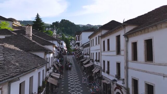 Top Down View of Gjirokast&euml;r&rsquo;s Cobblestone Street.  A vertical aerial view capturing the patterned cobblestone street of Gjirokast&euml;r framed by traditional stone rooftops. The geometric design and hist