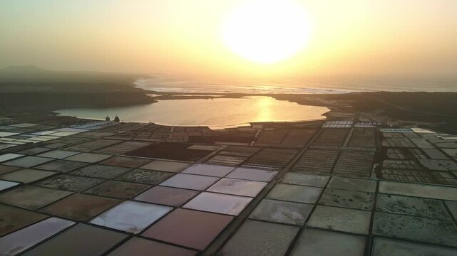 Aerial images of the Janubio salt flats on the island of Lanzarote, and the Canary Islands, in Spain, during sunset, 4k 30fps 1 inch sensor DJI, drone image