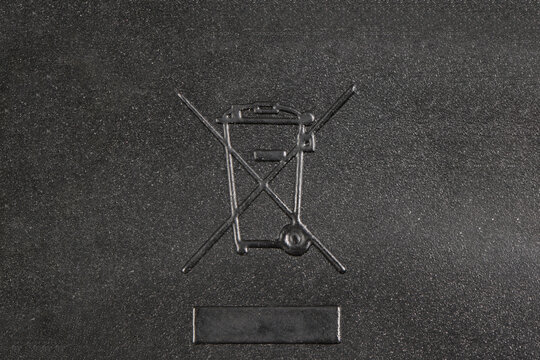 WEEE Symbol Crossed-Out Wheeled Bin on Dark Background