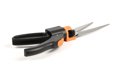 Black and orange garden grass shears isolated on white background